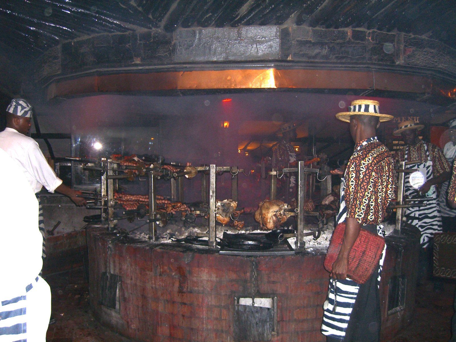 Meat_roasting_at_Carnivore_restaurant_in_Nairobi.jpg